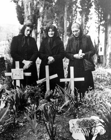 Women in Kalavrita in front of the graves of their relatives. Municipal Museum of the Kalavritan Holocaust. 